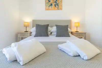 a bedroom with two white pillows on a bed at Funchal pad with Harbor Views & cool Aircon Bliss in Funchal