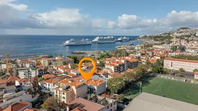 a view of a city with ships in the water at Funchal pad with Harbor Views & cool Aircon Bliss in Funchal