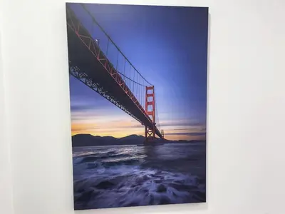 a picture of the golden gate bridge at sunset at CGD São Vicente Apartments in São Vicente