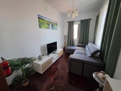 a living room with a couch and a tv at Silva House in Ribeira Brava