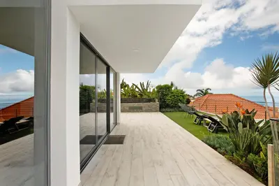 an external view of a house with a patio at Casa Jolie in Ponta do Sol