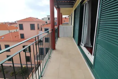 a balcony with a view of a building at Aqua City by Farmer's Market in Funchal