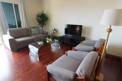 a living room with a couch and a coffee table at Aqua City by Farmer's Market in Funchal
