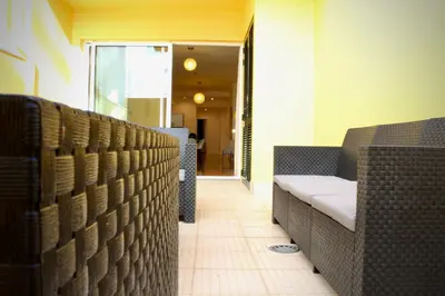 a waiting room with wicker chairs at Like Home III - Apartamento com 2 quartos, ideal para famílias e amigos in Funchal