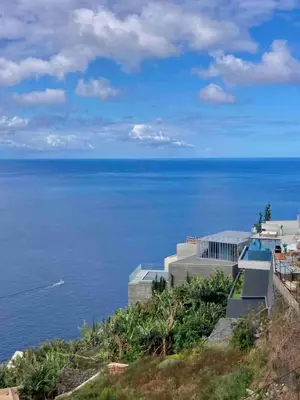 a view of the ocean from a house at Morning Glory Penthouse in Estreito da Calheta