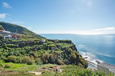a view of the ocean from a hill at Morning Glory 2 Bedroom Apartment in Calheta