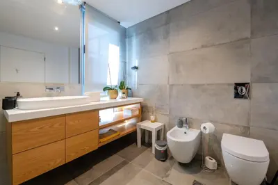 a bathroom with a sink and a toilet at The View residence in Funchal