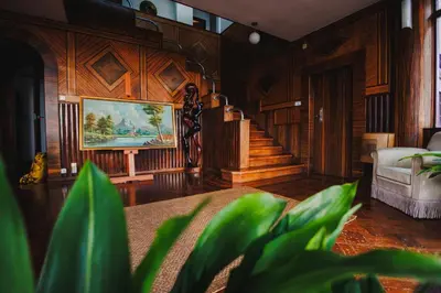 a living room with a staircase and a painting on the wall at Francisco's in Funchal