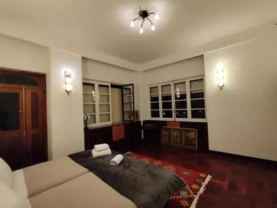 a large room with a bed and a chandelier at Francisco's in Funchal