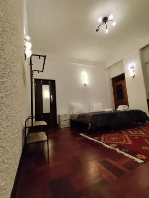 a bedroom with a bed and a hard wood floor at Francisco's in Funchal