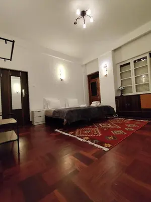 a bedroom with a bed and a wooden floor at Francisco's in Funchal