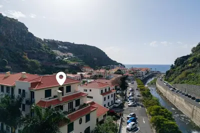 a view of a city with a river and buildings at Bela Vale Nº4 in Ribeira Brava