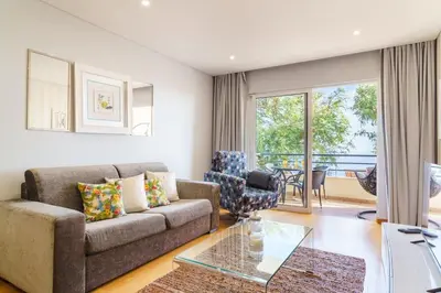 a living room with a couch and a table at GuestReady - Ocean-View Retreat in Caniço in Caniço