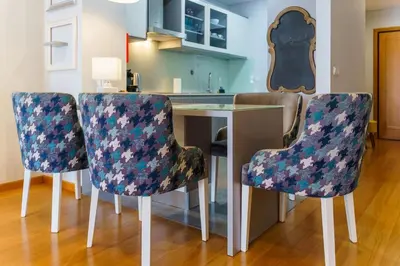 a kitchen with a table and two chairs at GuestReady - Ocean-View Retreat in Caniço in Caniço