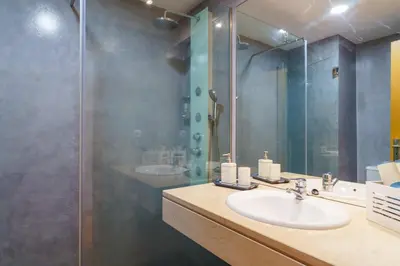 a bathroom with a sink and a shower at GuestReady - Ocean-View Retreat in Caniço in Caniço