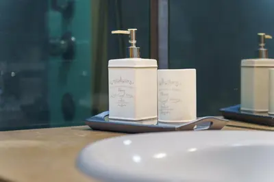 two bottles ofodorizers are sitting on a table at GuestReady - Ocean-View Retreat in Caniço in Caniço