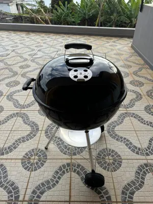 a black grill sitting on a tiled floor at Sunset House in Calheta