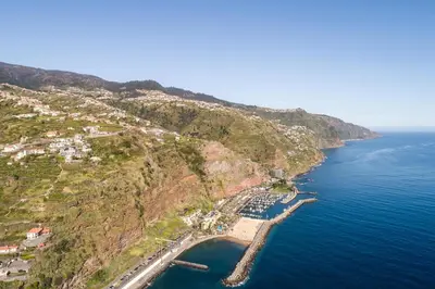 an aerial view of a mountain with the ocean at Sunset House in Calheta