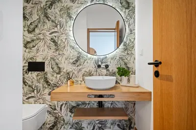 a bathroom with a sink and a mirror at Porto Moniz Atlantic View in Porto Moniz