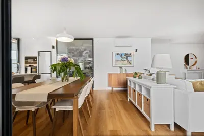 a dining room and living room with a table and chairs at Porto Moniz Atlantic View in Porto Moniz