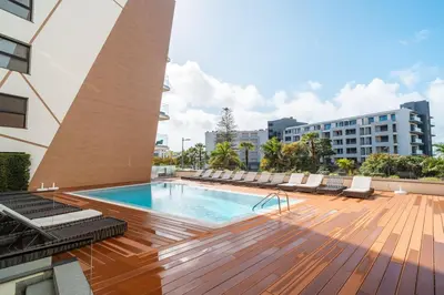 a pool on the roof of a building at Suite Q - Supermarket - Pool - AC - Private Parking Spot in Funchal