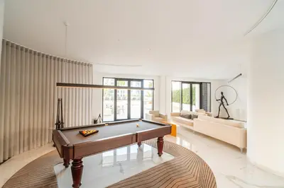 a living room with a pool table and a couch at Suite Q - Supermarket - Pool - AC - Private Parking Spot in Funchal