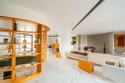 a living room with a couch and a table at Suite Q - Supermarket - Pool - AC - Private Parking Spot in Funchal