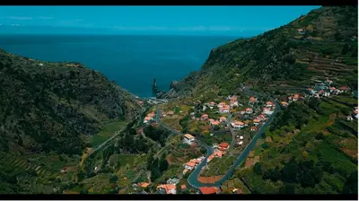 an aerial view of a village on a mountain at Pôr do Sol I in Porto Moniz