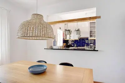 a dining room with a table with a bowl on it at Arrifana Ocean View Villa in Aljezur