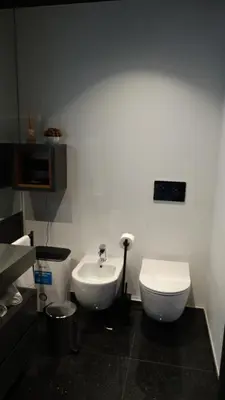 a bathroom with a white toilet and a sink at Heaven and Sea in Madeira in Funchal