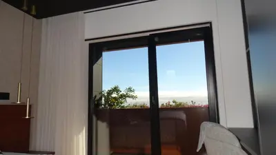 a room with a sliding glass door with a view at Heaven and Sea in Madeira in Funchal