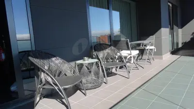 a row of chairs and tables on a balcony at Heaven and Sea in Madeira in Funchal