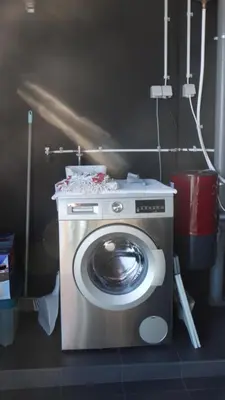 a washing machine in a bathroom with a washing machine at Heaven and Sea in Madeira in Funchal