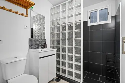 a bathroom with a toilet and a sink at Matur Place in Machico in Machico