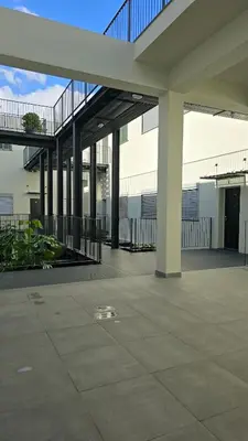 an empty courtyard of a building with a staircase at Urban Funchal Charming Apartment in Funchal
