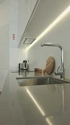 a kitchen with a stainless steel sink with a sink at Urban Funchal Charming Apartment in Funchal