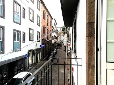 a view from a balcony of a street with buildings at CA Tanoeiros 1 in Funchal