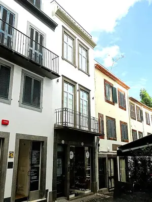 a white building with balconies on a street at CA Tanoeiros 1 in Funchal