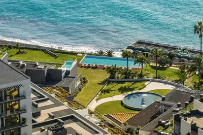 an aerial view of a resort with a swimming pool and the ocean at Acqua Residence I by An Island Apart in Funchal