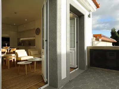 a balcony with a view of a kitchen and a living room at CA Tanoeiros 2 in Funchal