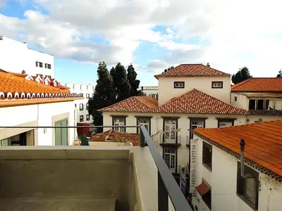 a view from a balcony of buildings with roofs at CA Tanoeiros 2 in Funchal