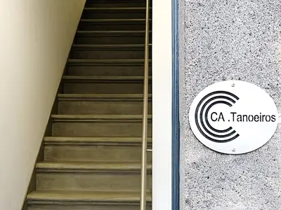 a staircase with a sign on the side of a building at CA Tanoeiros 2 in Funchal