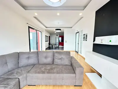 a living room with a couch and a table at Private Rooftop Sunny Terrace in Funchal in Funchal