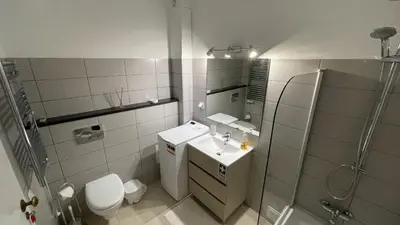 a bathroom with a toilet and a sink and a shower at Pipoca in Luz