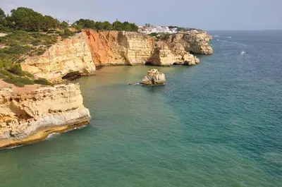an aerial view of the ocean with rocky cliffs at Pipoca in Luz