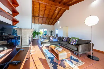 a living room with a couch and a table at Casa Arafel in Aljezur