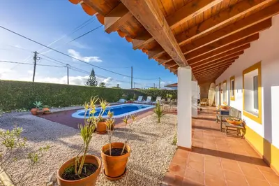 an external view of a house with a swimming pool at Casa Arafel in Aljezur