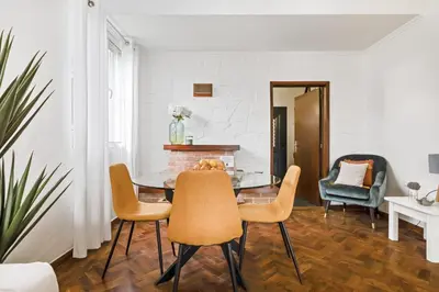 a dining room with a table and chairs at Casa do Santo by Homie in Santo da Serra