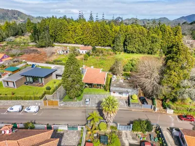 an aerial view of a house with a parking lot at Casa do Santo by Homie in Santo da Serra