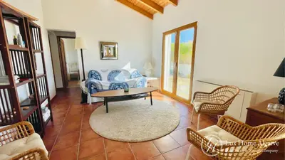 a living room with a couch and chairs and a table at CasaÂncora - Sea View Rooftop - 1km Beach - Garden in Raposeira